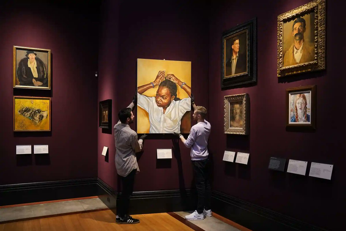 One of @guardian photos of the day! Our great collections managers Nyl Fall and Richard Carpenter installing new acquisition 'Zipporah' by Barbara Walker in our revamped paintings galleries, opening tomorrow @FitzMuseum_UK !