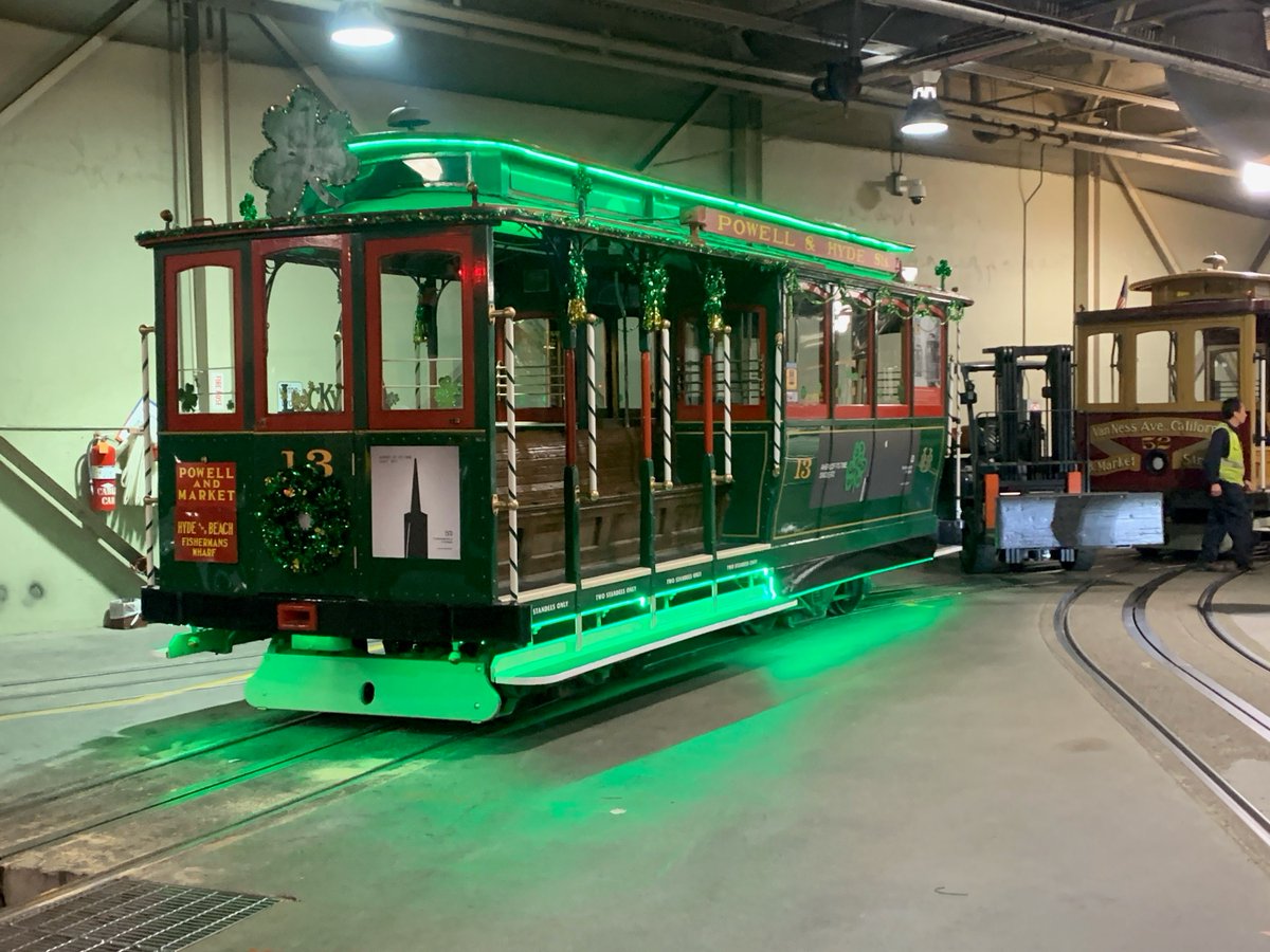 IBEW_Local_6's tweet photo. Lucky Cable Car 13 ready for St. Paddy’s Day Weekend runs, decorations courtesy of IBEW members working at the Cable Car Barn. Only fittting for the oldest version of green transit in SF!!!

Proudly serviced, maintained, &amp; repaired by the @ibew members of Local 6. @ECI415 @sfmta https://t.co/hvNiMQXQwq