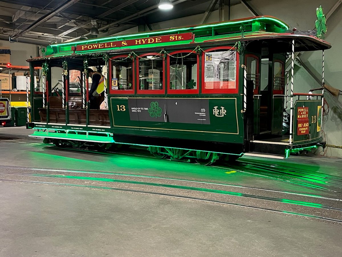 IBEW_Local_6's tweet photo. Lucky Cable Car 13 ready for St. Paddy’s Day Weekend runs, decorations courtesy of IBEW members working at the Cable Car Barn. Only fittting for the oldest version of green transit in SF!!!

Proudly serviced, maintained, &amp; repaired by the @ibew members of Local 6. @ECI415 @sfmta https://t.co/hvNiMQXQwq