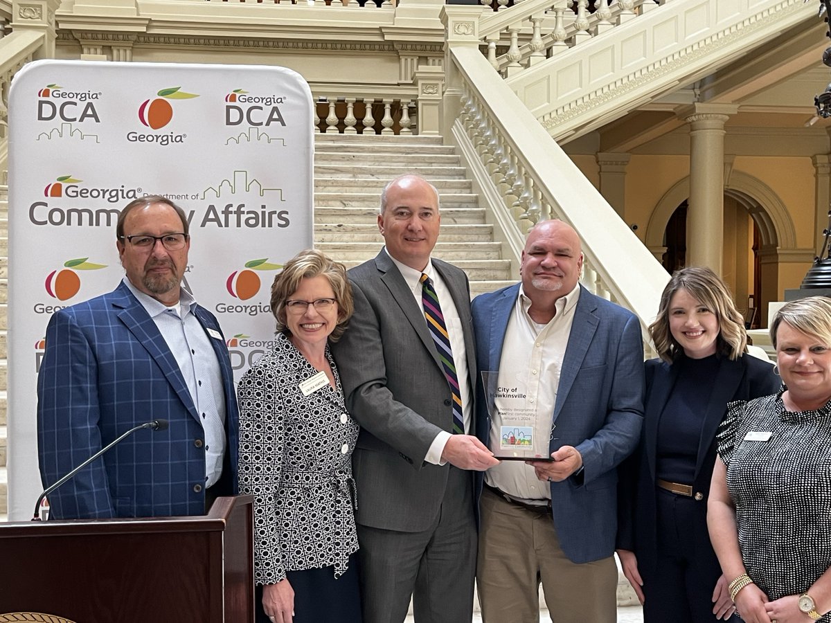 GA_DCA's tweet photo. Today at the Capitol, Commissioner Christopher Nunn congratulates Bainbridge, Hawkinsville, @cityofmarietta, and Perry on achieving the PlanFirst designation. Their dedication to comprehensive planning and community development sets a shining example for all. #PlanFirst https://t.co/Q18RJKSqGI