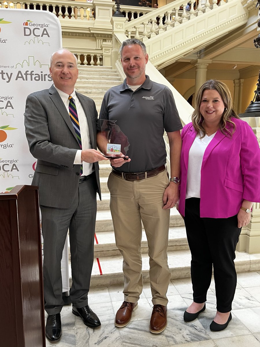 GA_DCA's tweet photo. Today at the Capitol, Commissioner Christopher Nunn congratulates Bainbridge, Hawkinsville, @cityofmarietta, and Perry on achieving the PlanFirst designation. Their dedication to comprehensive planning and community development sets a shining example for all. #PlanFirst https://t.co/Q18RJKSqGI