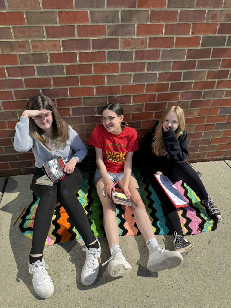 We took day one of historical fiction book clubs outside on this beautiful day! #180wayslionslead 📖🖤🧡