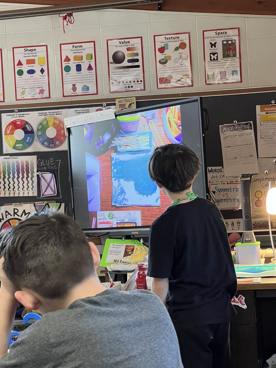 Students in art using feedback protocol to provide feedback and suggestions to each other #glow #growth