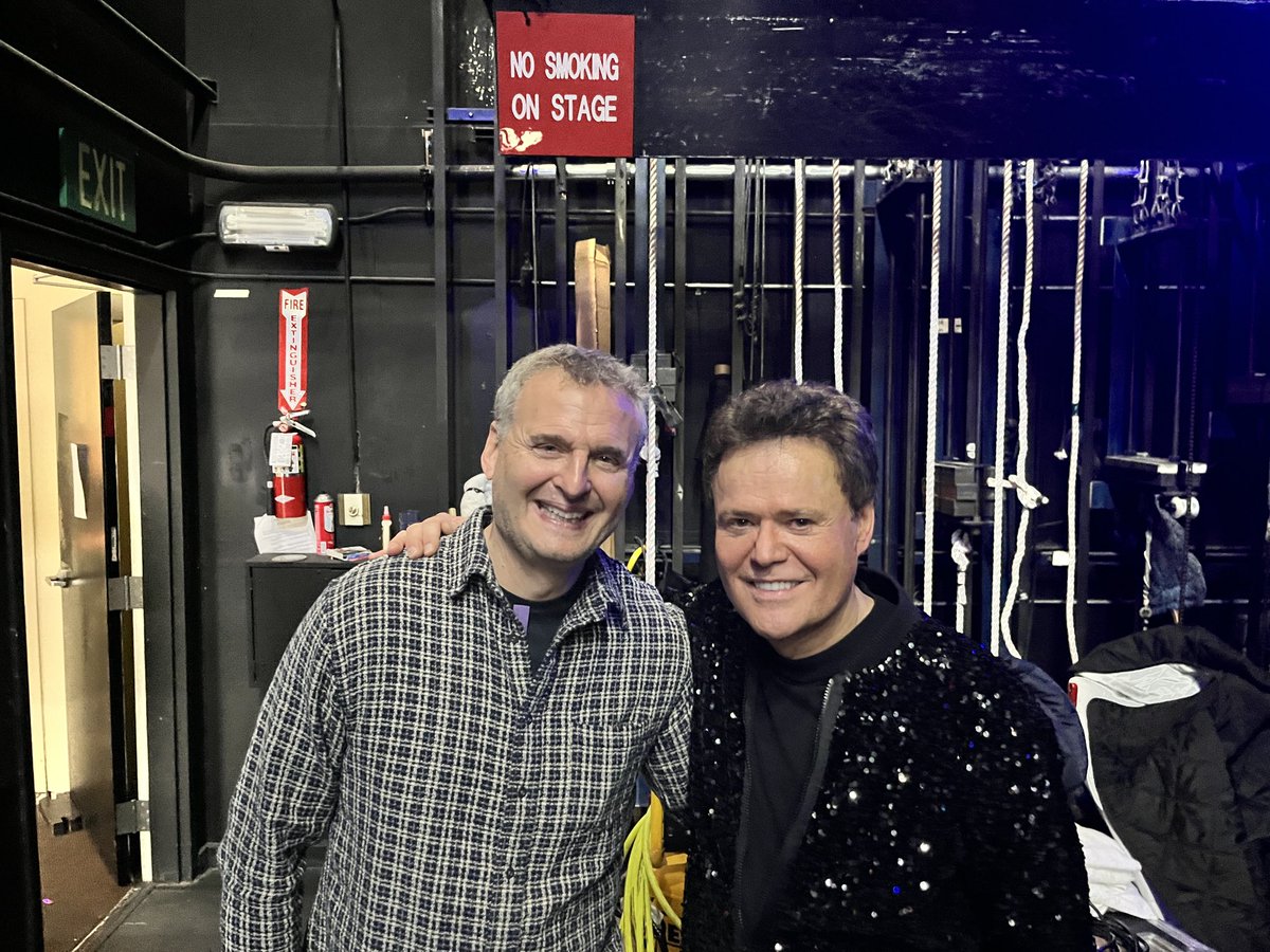 Tonight ⁦@PhilRosenthal⁩ & I saw ⁦@donnyosmond⁩’s amazing show at ⁦@HarrahsVegas⁩. Tomorrow we record our 100th episode live with Donny on his stage. Please note that I am not in this photo because I’m One Bad Apple.