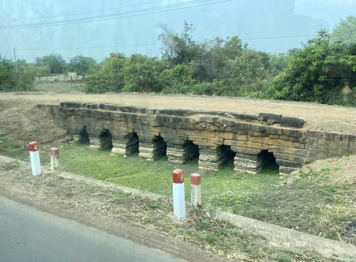 AndyBrouwer's tweet photo. En route from Phnom Penh to Siem Reap #Cambodia and you might spot one of 10 x 800-year-old bridges built by the Khmer Empire, which have been saved for posterity. Pic taken from my bus seat. https://t.co/bbId1LsUsh