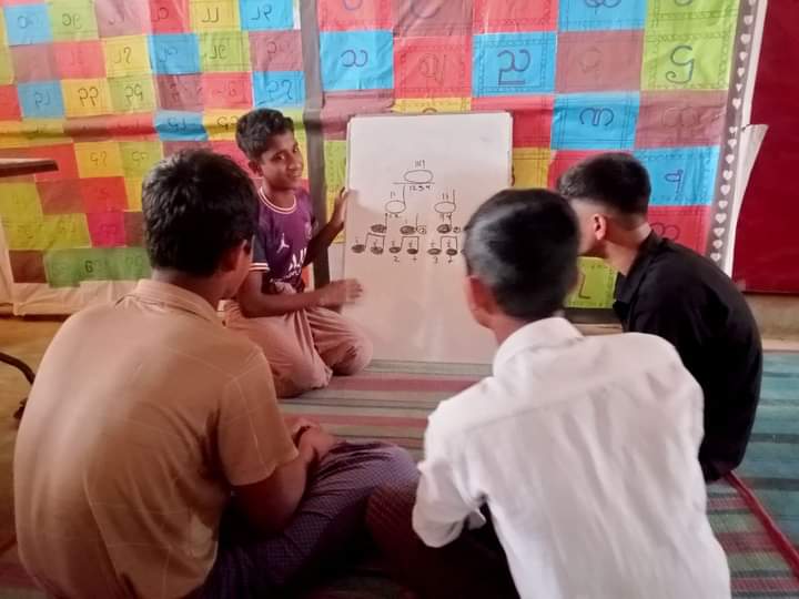 PialShil's tweet photo. Inspiring Leadership and Collaboration through Music Education. A young Rohingya refugee from our music program is demonstrating exceptional leadership by sharing their musical knowledge. @YASID16610448 @UNHCR_BGD @UNICEFBD #MentalHealth #PTMI
#Rohingyarefugees  #musiceducation https://t.co/Y5JC2xjCxP