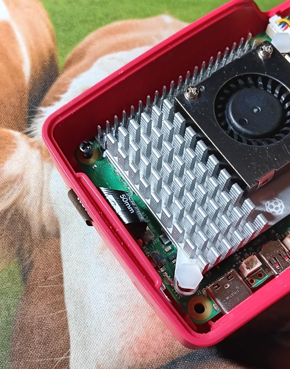 RaspberryConnec's tweet photo. I have been waiting for a NVMe addon that fits the  official #raspberrypi 5 case. Then @pimoroni brought out a longer pcie cable. So i went for the NVMe base. But the cable is too short. So I modded the case instead. Now it fits. It just need some longer screws to fit inside. https://t.co/gZTX5qrmnI