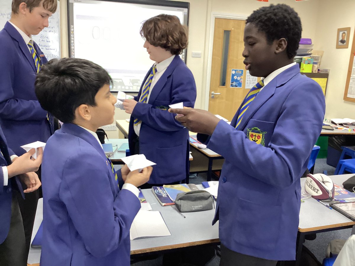 Year 8 practising using the future tense in French by making fortune tellers.