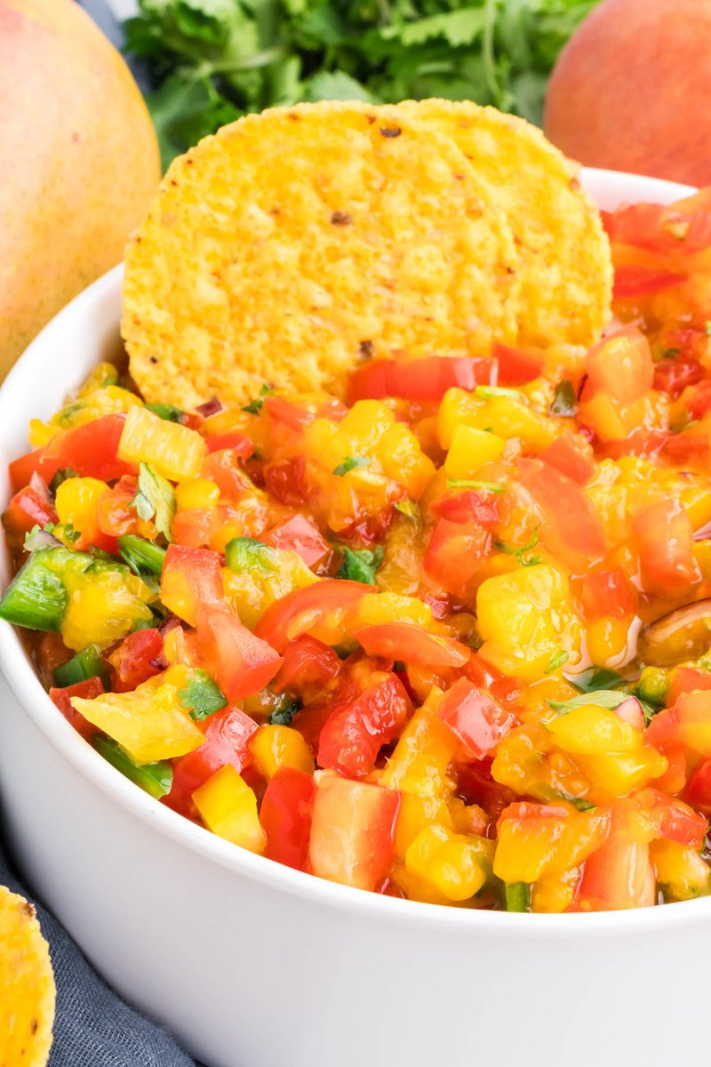 How to make a fresh and colorful mango peach salsa recipe from scratch. Sweet and savory, quick and easy side dish or appetizer with just the right amount of spice. This healthy and delicious spin on traditional salsa is perfect for the summer! adventuresofmel.com/mango-peach-sa…