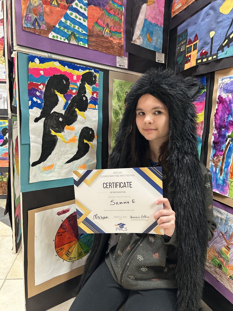 Ms.Ivan celebrated with Triangle artists at the district's art show earlier this month! Way to go Tigers! (3/3)