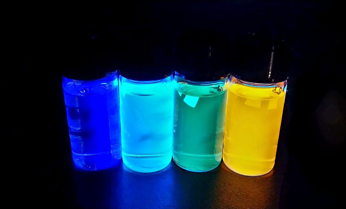 Fluorescence Friday brings a spectrum of color! 🌈 Check out these four flasks featuring polyaromatic dyes, each emitting a unique glow with increasing emission wavelengths. Science meets art in a vibrant display! #FluorescenceFriday #PolyaromaticDyes #womeninstem #womeninscience