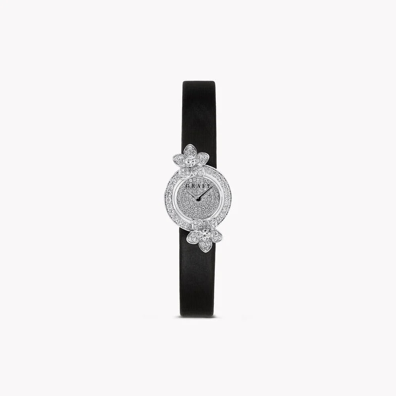 GRAFF DIAMONDS / WILD FLOWER WATCH

Elegance in every detail. The Wild Flower watch in 18-carat white gold features a pavé diamond dial and bezel, totaling approximately 0.86 carats. Paired with a black satin strap, it's a stunning accessory.

#Graff #WildFlower #DiamondWatch