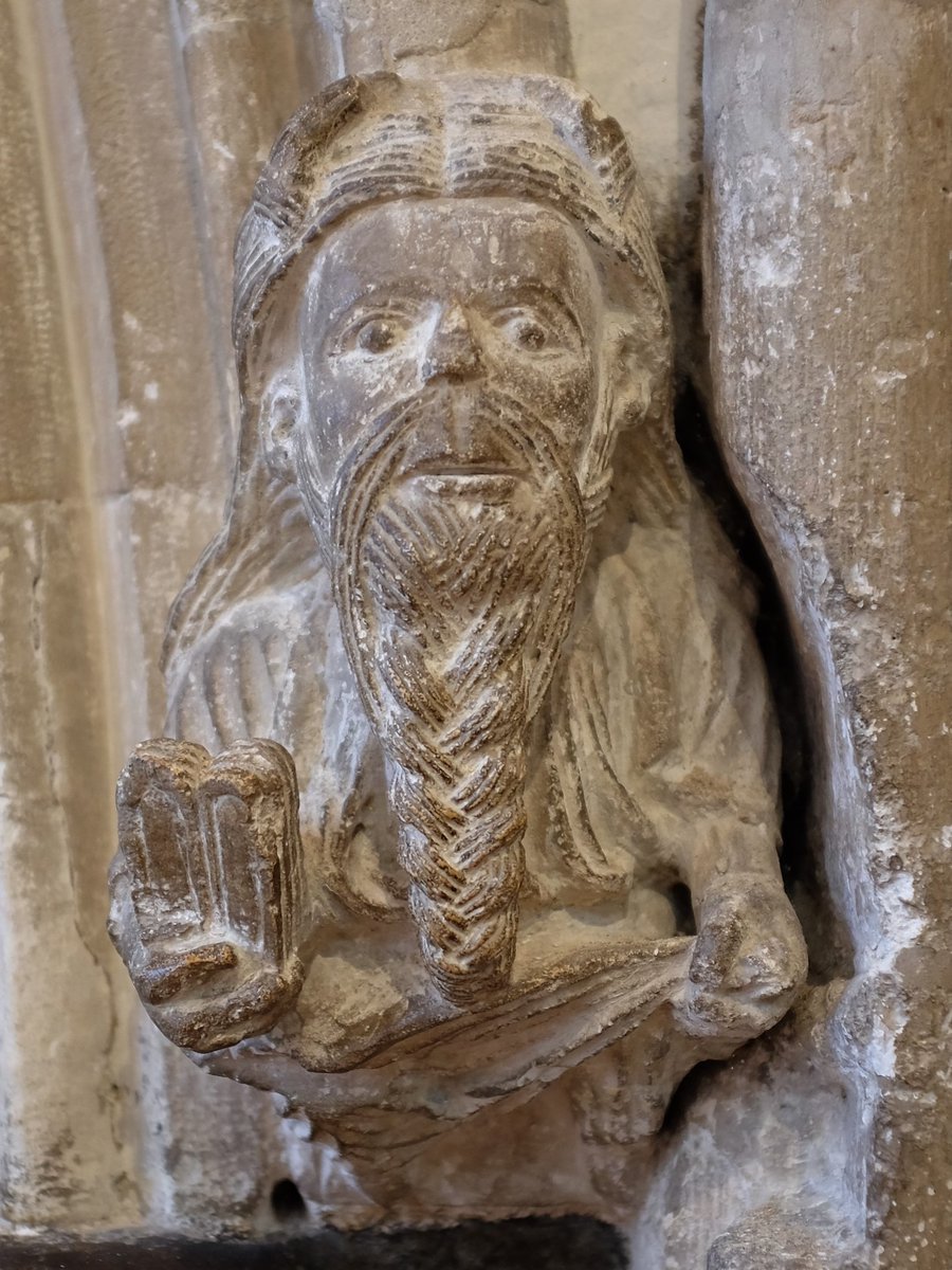 Wimborne Minster #Dorset 
'Outstandingly good hoodmould stops, especially of Moses, of c.1200, re-set' (Pevsner). Moses with horns, from a mistranslation of Hebrew for 'shone', leading to common depiction in this period. Love the plaited beard! #StoneworkSunday #FavouriteCarvings