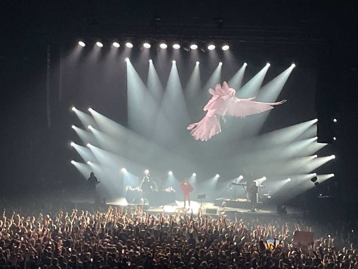 markmackinnon's tweet photo. Friday night. Vilnius. Antiwar band Bi-2 on stage for the first time since the Kremlin tried to nab them in Thailand. The sellout crowd - many of whom are exiles from Putin’s Russia and Lukashenko’s Belarus - roars as a giant dove appears on screen behind the band… https://t.co/VSDiKECHoS