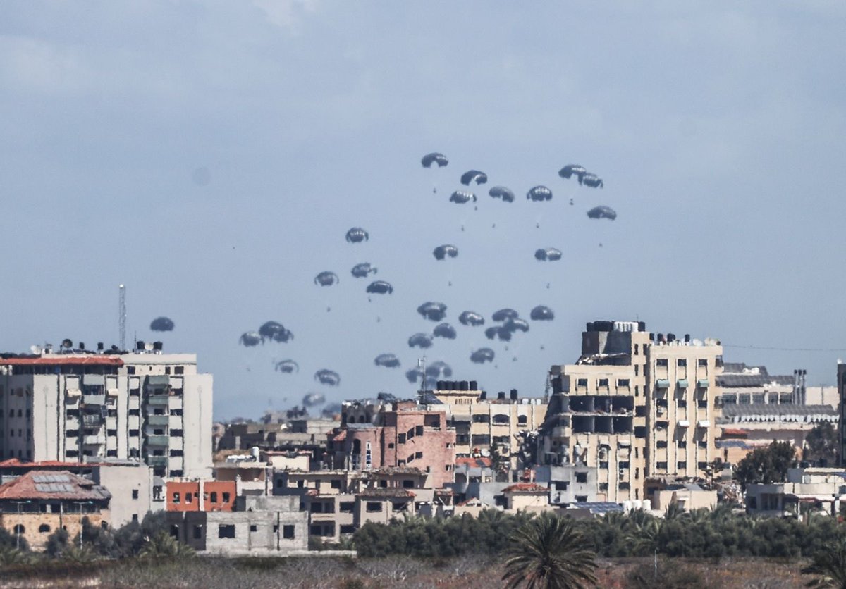 Planes drop humanitarian aid over northern Gaza as the Israeli attacks and blockades continue in Gaza City, Gaza on March 15, 2024. (Photo by Ali Jadallah/Anadolu via Getty Images)