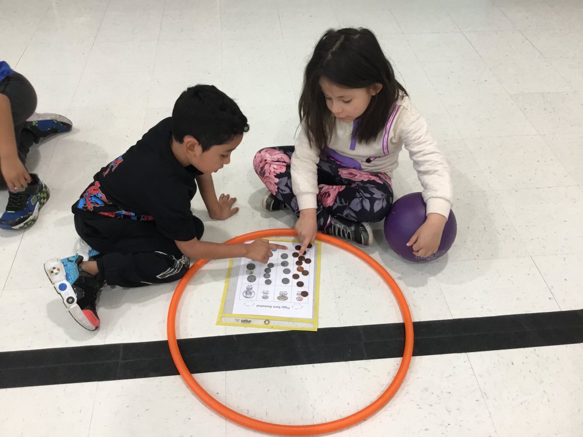Piggy Bank Basketball (Grade K/1/2)
Students were learning about money while playing basketball.
