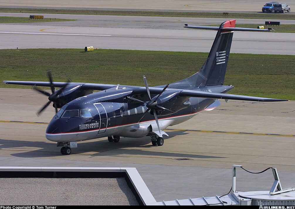ClassicsPlanes's tweet photo. A US Airways Express Dornier-328-110 seen here in this photo at Charleston Airport in July 2004 #avgeeks 📷- Tom Turner https://t.co/2hJOmhkttD