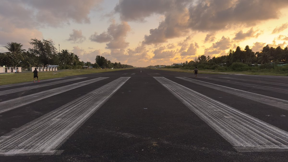 Early morning look at the runway at FUN, the only airport in #Tuvalu. The country is so small that the runway becomes a social meeting point for the people from football games to jogging to passed out drunks.