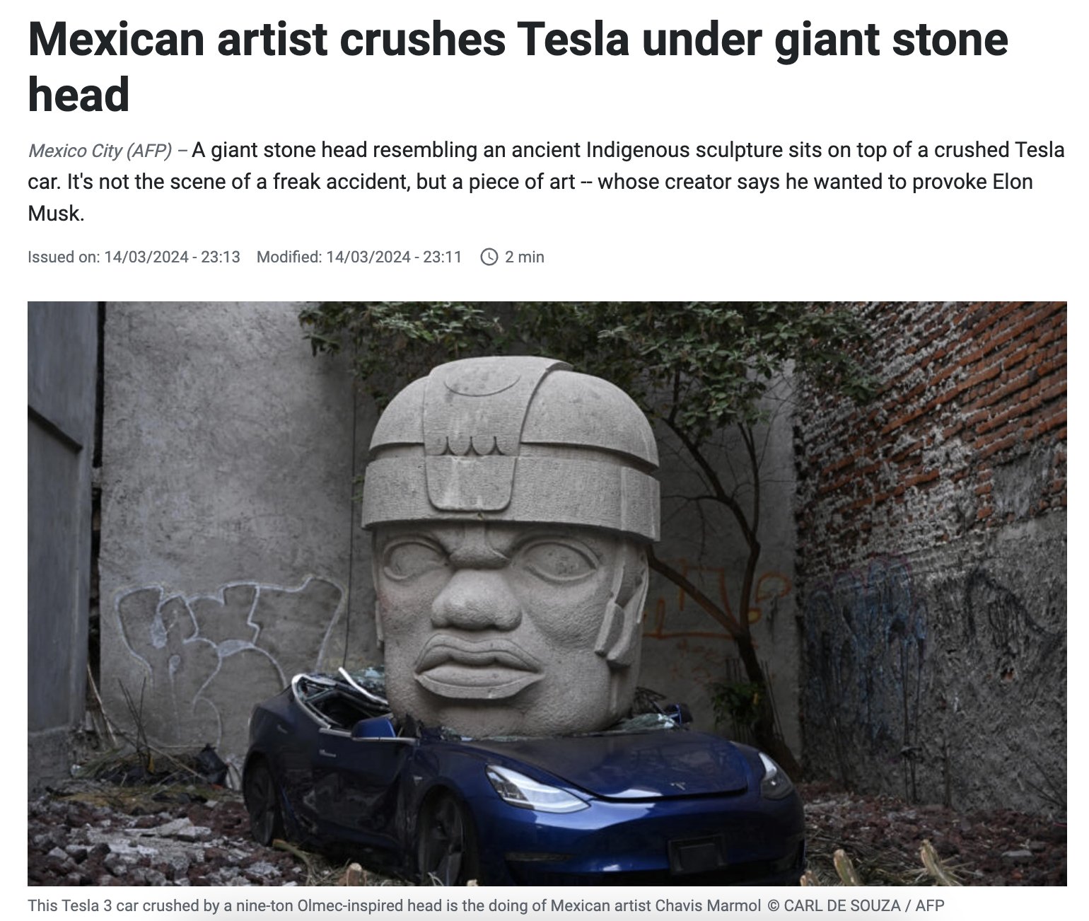 Mexican artist crushes Tesla under giant stone head
