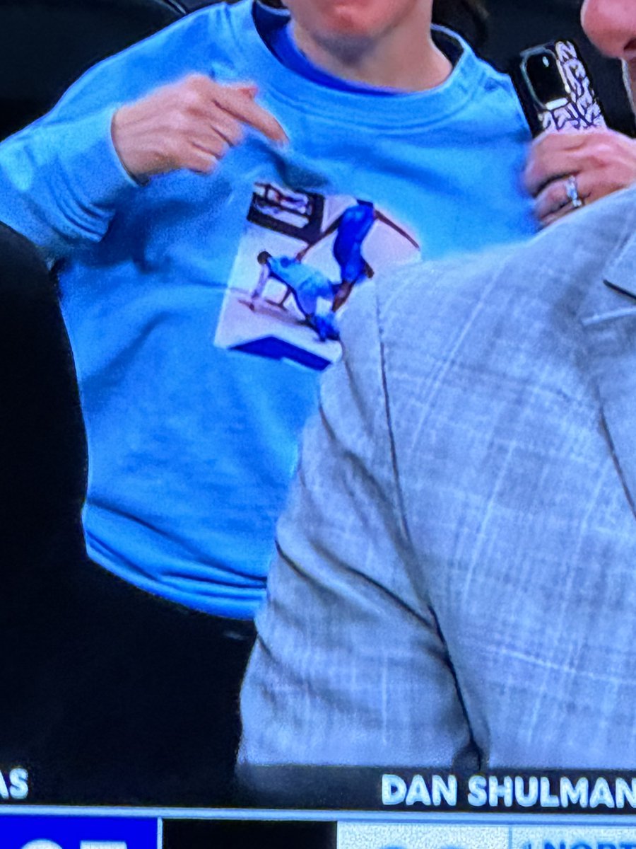 GoshdarnTony's tweet photo. Mad respect to the UNC fan commemorating the #FlipTrip behind Bilas and Shulman. https://t.co/g2m4x932tf
