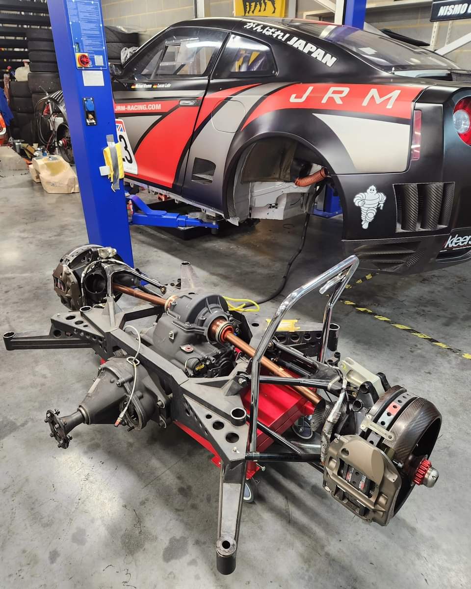 NISSAN GT1 UPDATE ⚫️🔴⚫️🔴

As part of the re-commission to make the car race legal, we needed to get the fuel tank out so that we could get a new one made. It sits in a carbon box that's accessed from underneath, so out came the rear subframe to make room for the removal