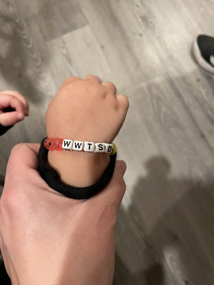 BridgetInAction's tweet photo. While making bracelets, Max demanded he be made one. He hand picked the pink and yellow beads, so I sat down and made that boy a pink and yellow bead Taylor Swift bracelet. He loves showing it off. https://t.co/V8xBCNfHaU