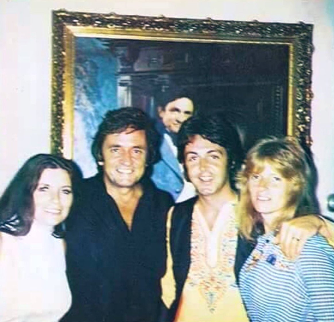 I didn’t know “Johnny Cash and Paul McCartney posing with their wives in front of a fucking portrait of Johnny Cash” was a thing that needed to happen until right now but thank god it did.