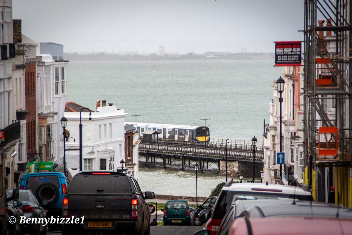 #Islandline The Isle of Wights 484004 on its way to Ryde Pier station. Viewed from Union Street. With Portsmouth in the background.