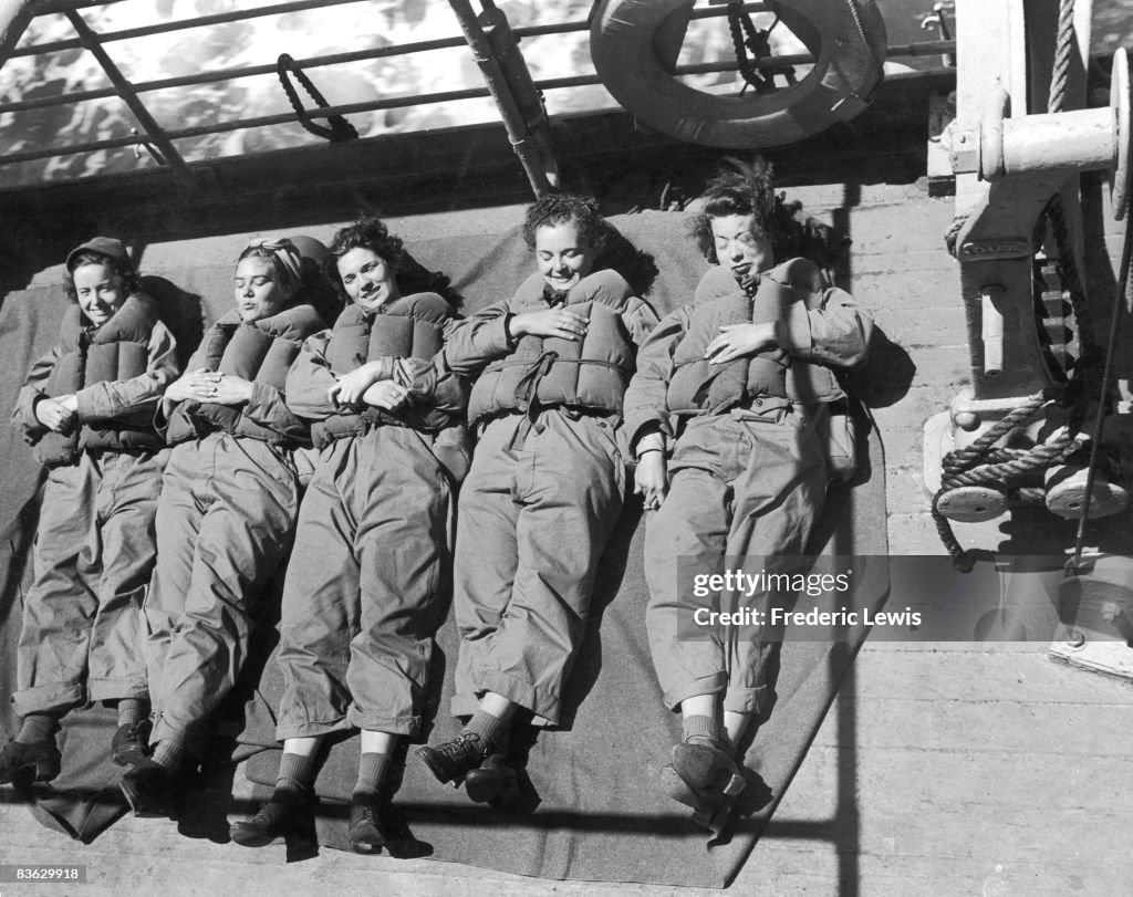 Mary S. Hughes, Helen Marsh, Kate L. Green, Pauline R. Dundas and Norma Lillick.- ORs of the WACS (Women's Army Corps) of the US Army, on a ship bound for North West Africa, 1942.