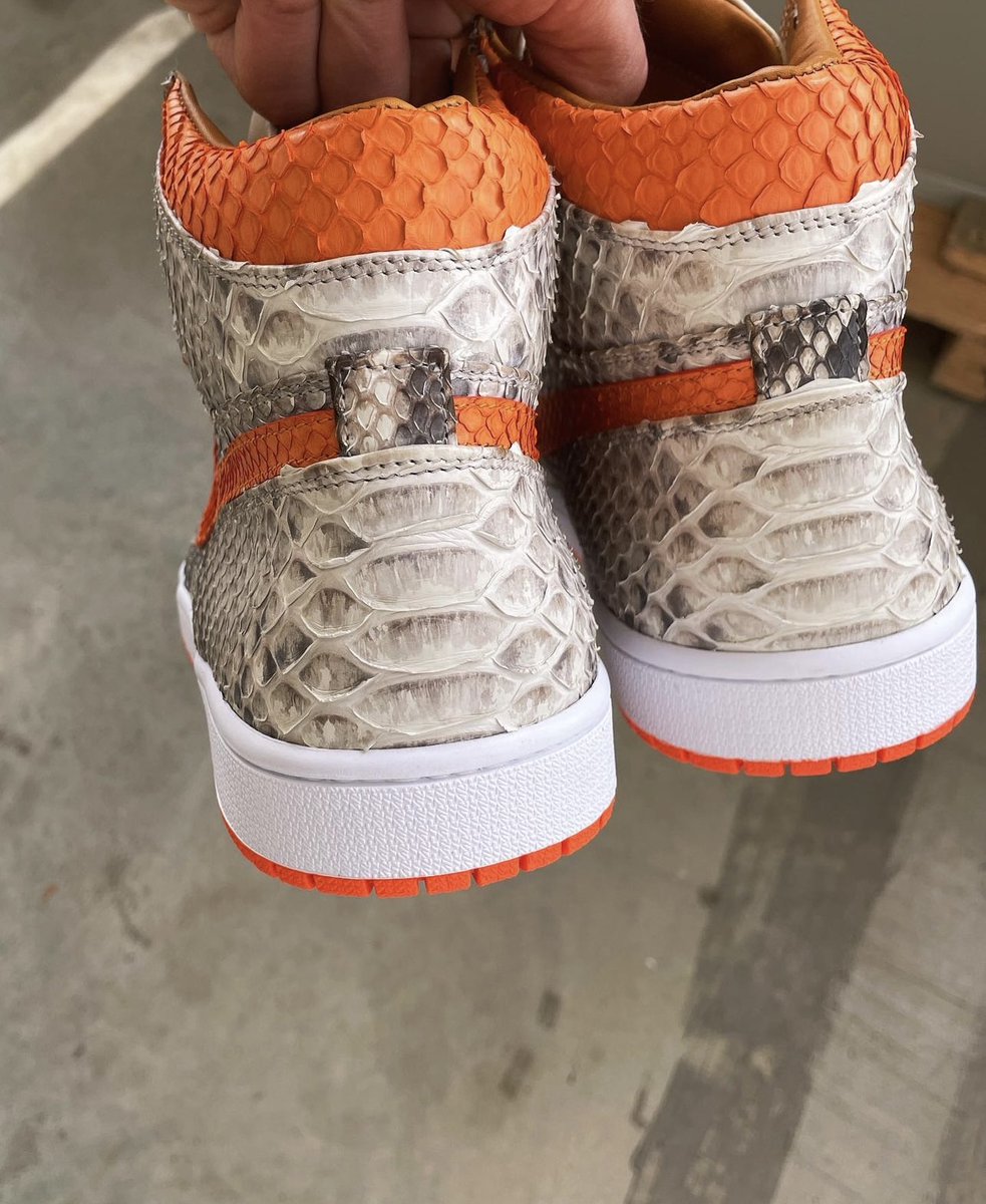 Check out custom Nike Dunk Highs in Black &amp; White Python with striking Orange Swoosh - a luxe, bold twist on a classic! 👟🧡🔥🐍

🎨 Soles Curated by: @jbfcustoms

#sneakers #nike #shoes #streetstyle #sale #adidas #streetwear #jordan
#hypebeast #sneakerhead #sneakerheads