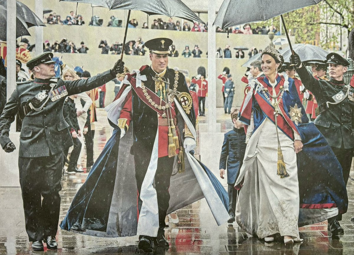 This great picture of the Prince and Princess of Wales is so symbolic: people are raining on their parade, but these two lovely people know who they are and what they are standing for and they will keep on going.