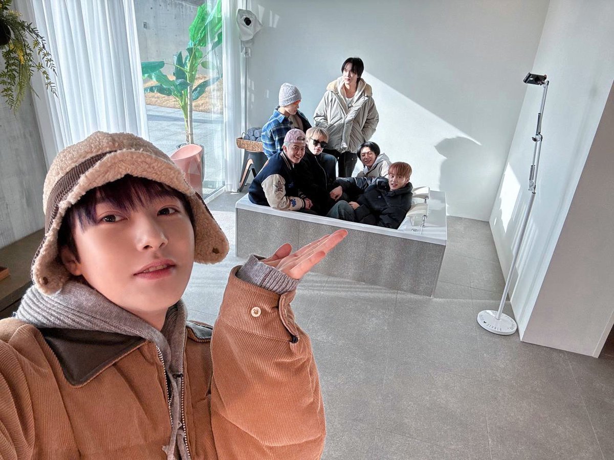 Peep this pic with the hyungs, Renjun hyung holdin' it down with the camera – ain't we lookin' hella tight and on point together?!   We ain't just a crew, we a family, rockin' together and stayin' solid no matter what!