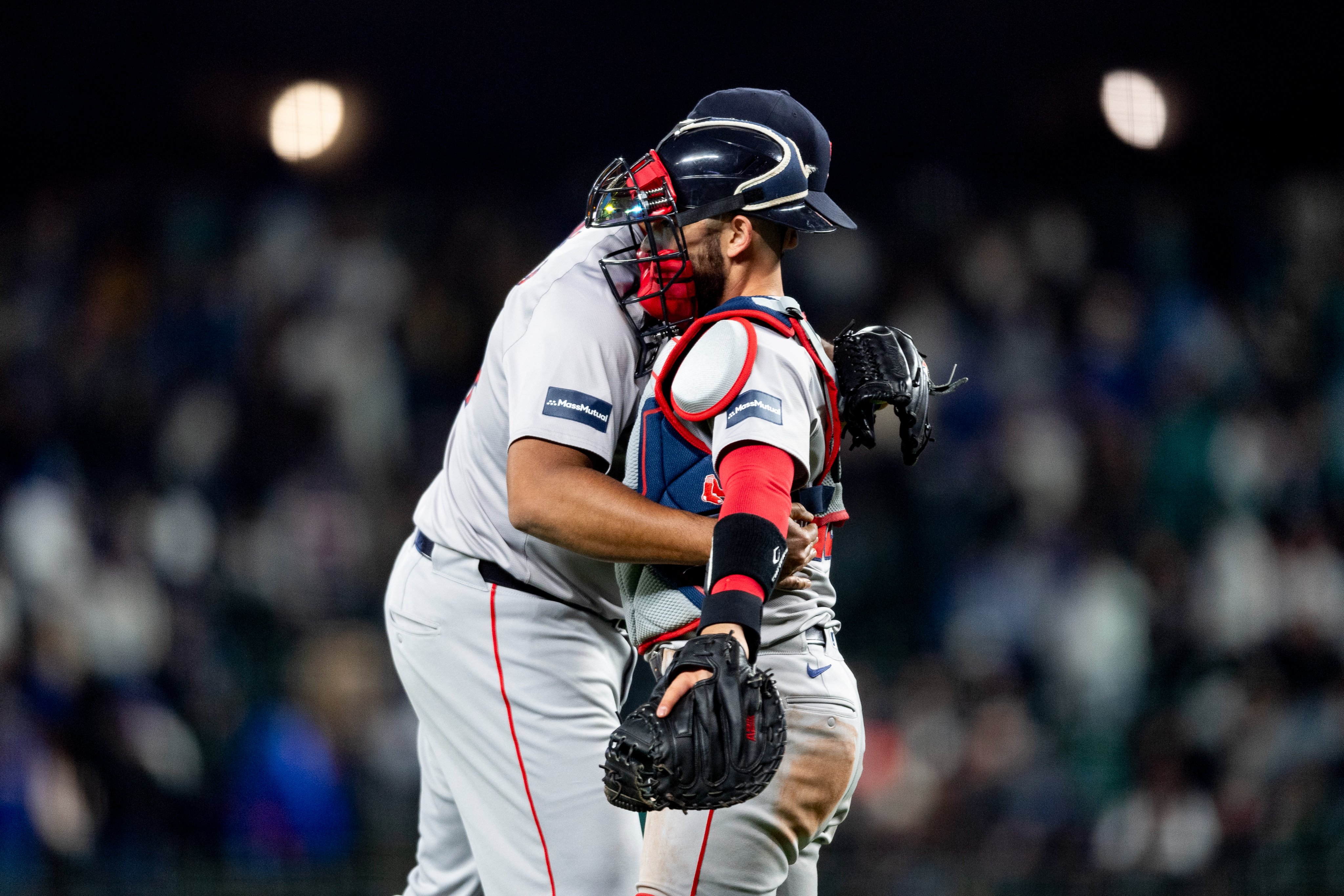 Kenley Jansen and Connor Wong hug after the Red Sox Opening Day win against the Mariners.