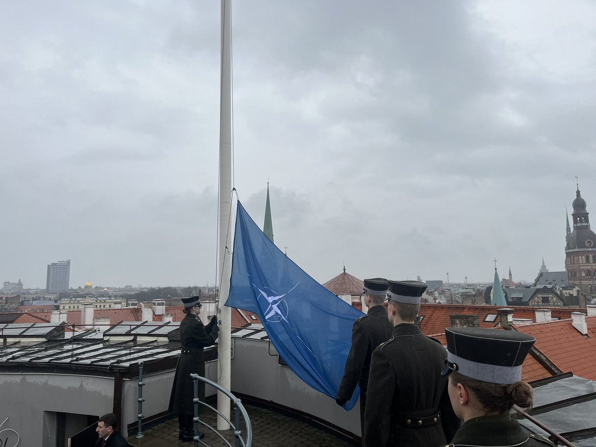 The flag raising ceremony at the Holy Spirit Tower of the Riga Castle. The flag of #NATO was raised next to the flag of Latvia 🇱🇻 and Presidential Standard to mark the 20y anniversary of our membership in NATO. In this rainy morning the Alliance is strong :) #WeAreNATO