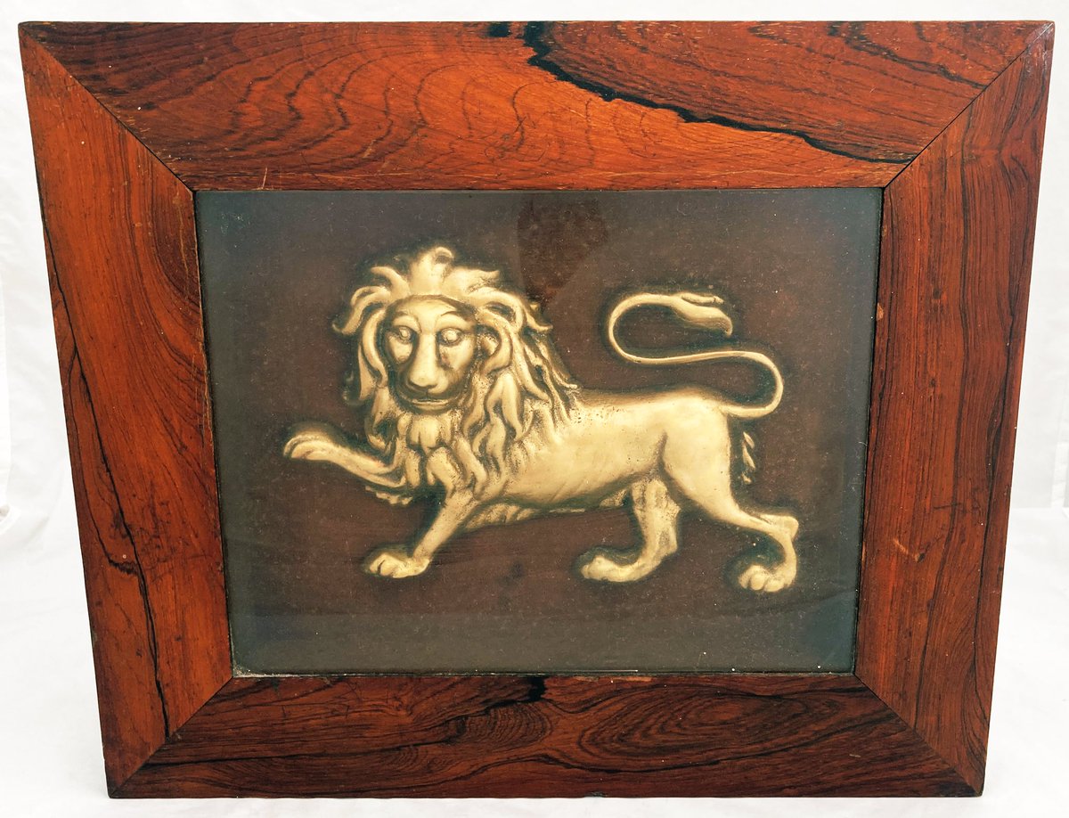 A 19th century framed and glazed gilt metal lion plaque. #antiques