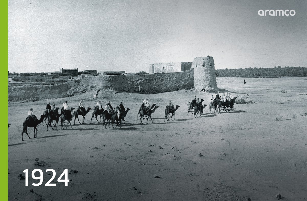 A camel caravan crosses the walls of Al Hofuf, a commercial center in the Al-Ahsa region Years later, our first geologists would arrive to the same region to begin their oil exploration in nearby areas #aramco