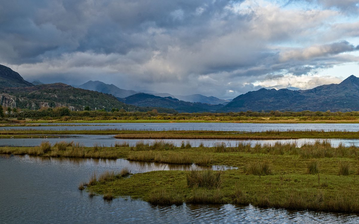 The mountains of Snowdonia getting a bit of wet from Porthmadog  Cob.  Eryri National Park.