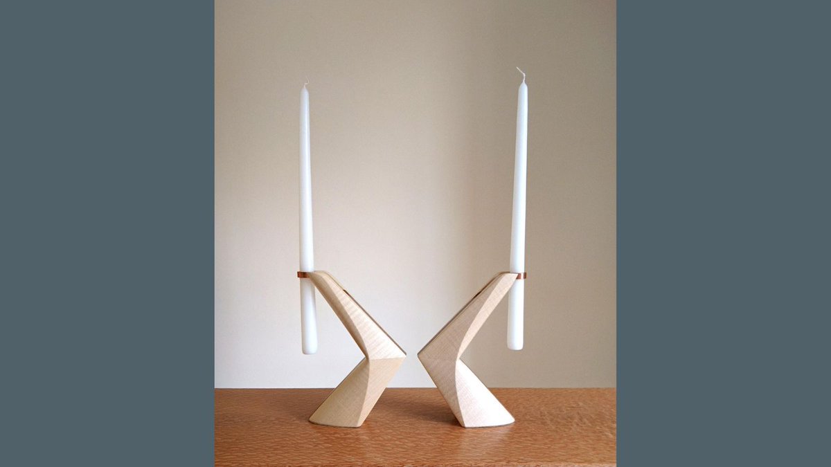 The Cloven Candlesticks (sold as a pair) by Laurent Peacock are the perfect contemporary accessory to any home. The combination of various materials, as well as the mix of smooth and sharp facets in the design of the candlesticks, create a beautiful visual contrast in the piece.