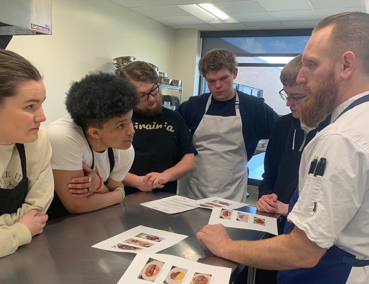 JohnstonCSD's tweet photo. JHS ProStart students this week got to learn and create culinary dishes with Chef Anthony Nace, the Executive Chef at Hilton Downtown Des Moines and winner of the 2023 Iowa Restaurant Association Culinary Competition. Chef Anthony took the time to remake his winning dish with the ProStart Students! Students got to make and eat Seared Beef Strip Loin with Roasted Golden Beets, Purple Street Potatoes, Sauteed Brussels Sprouts, Agave Pumpkin Butter, Aged Cheddar Cheese, and Micro Cilantro. Students enjoyed cooking and plating their own food while being mentored by a professional, well renowned chef!s