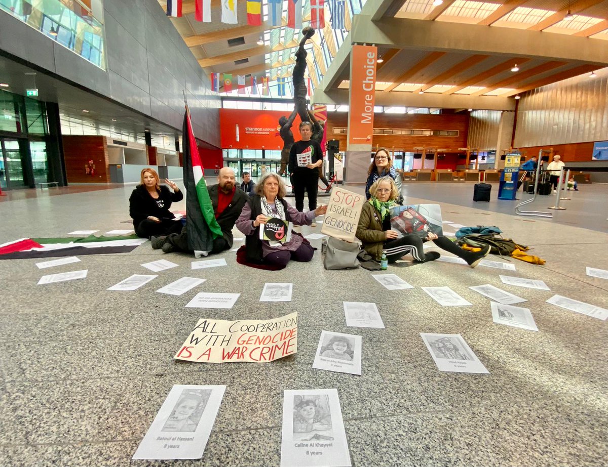 A sit-in protest was held inside Ireland's Shannon Airport this morning, where activists holding signs read a statement followed by a reading of the names of children killed in the conflict in Gaza. #GoodFriday #GazaGenocide #USMilitaryOutOfShannon