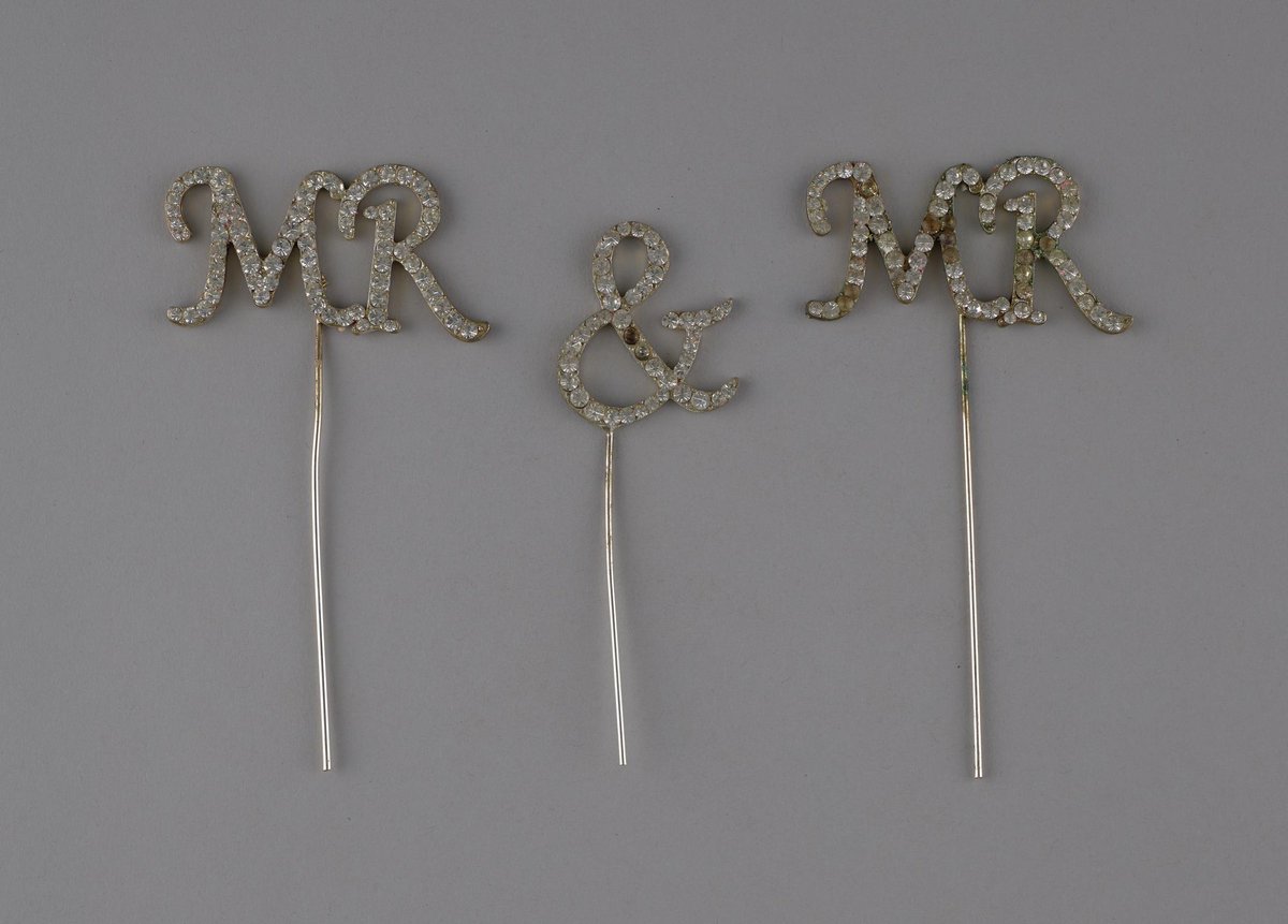 10 years ago today these wedding cake decorations were used on the top of the cake from a wedding in Swansea Civic Centre on 29 March 2014, the first day same-sex couples were allowed to marry in Wales following a change in legislation. From #LGBTQ+ collection @StFagans_Museum