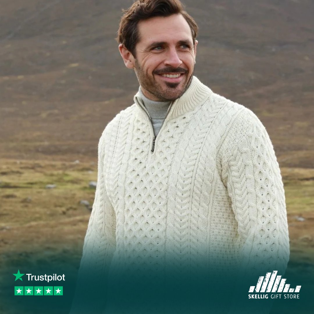 This luxurious sweater offers modern style with a traditional touch. Its half-zip design and antique brass finish adds a contemporary twist to the classic stitching, making it a must-have for any wardrobe. #IrishGifts #AranSweater #MensSweater #AranJumper