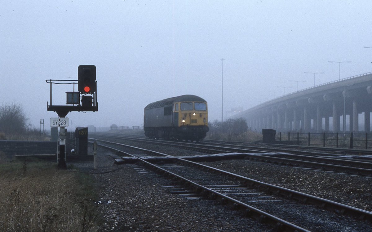 Birmingham - in the mist and fading light, 56040 near Bromford Bridge. Part of raised section of M6 to the right. My photo December 1978.