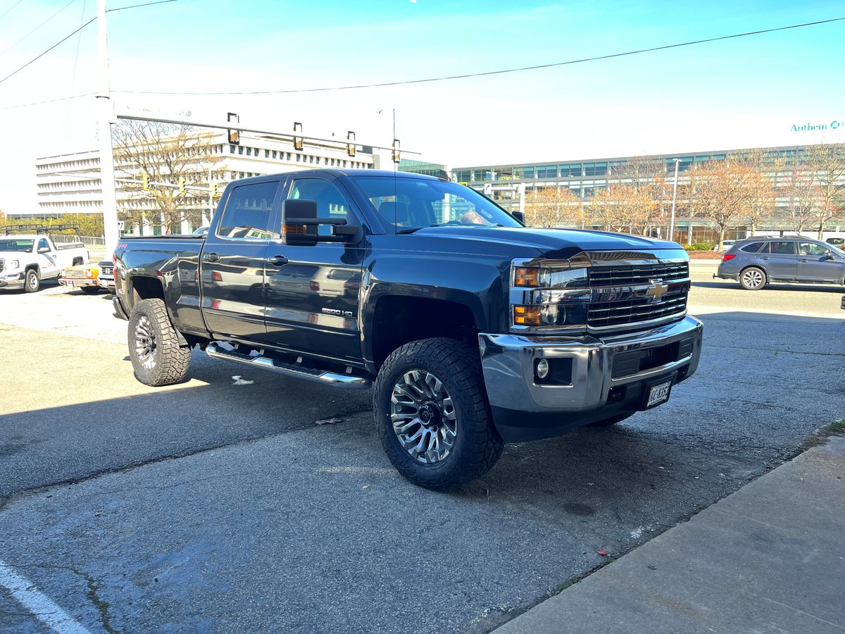 Look at these before and after pictures of this 2017 Chevy Silverado! Leveling kit & new Falken Wildpeak tires 🤩