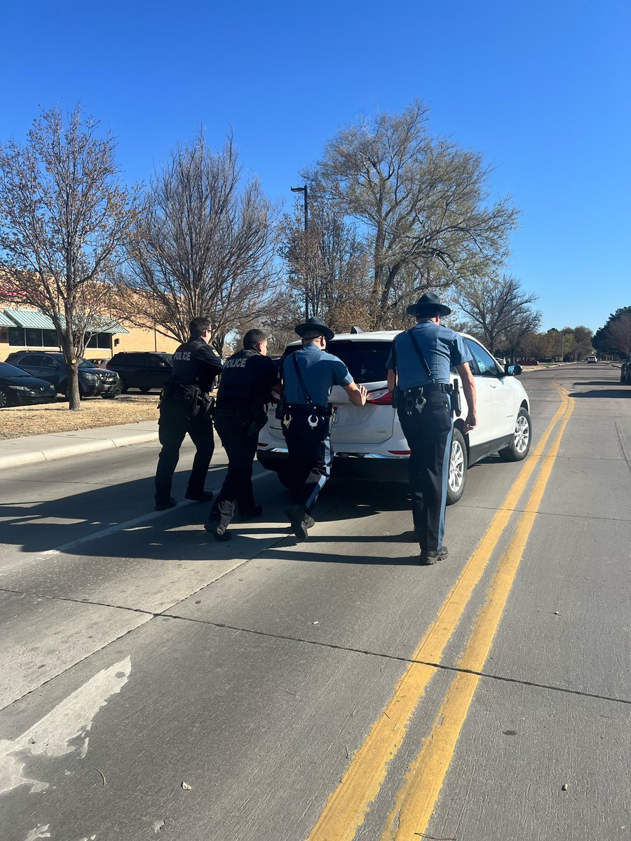 TEAM EFFORT: Officers and Kansas Highway Patrol - Troop E Troopers were observed pushing two stalled vehicles out of the way during the Friday 5:00 traffic rush. Teamwork makes the dream work! Thank you all for going above and beyond the call of duty.