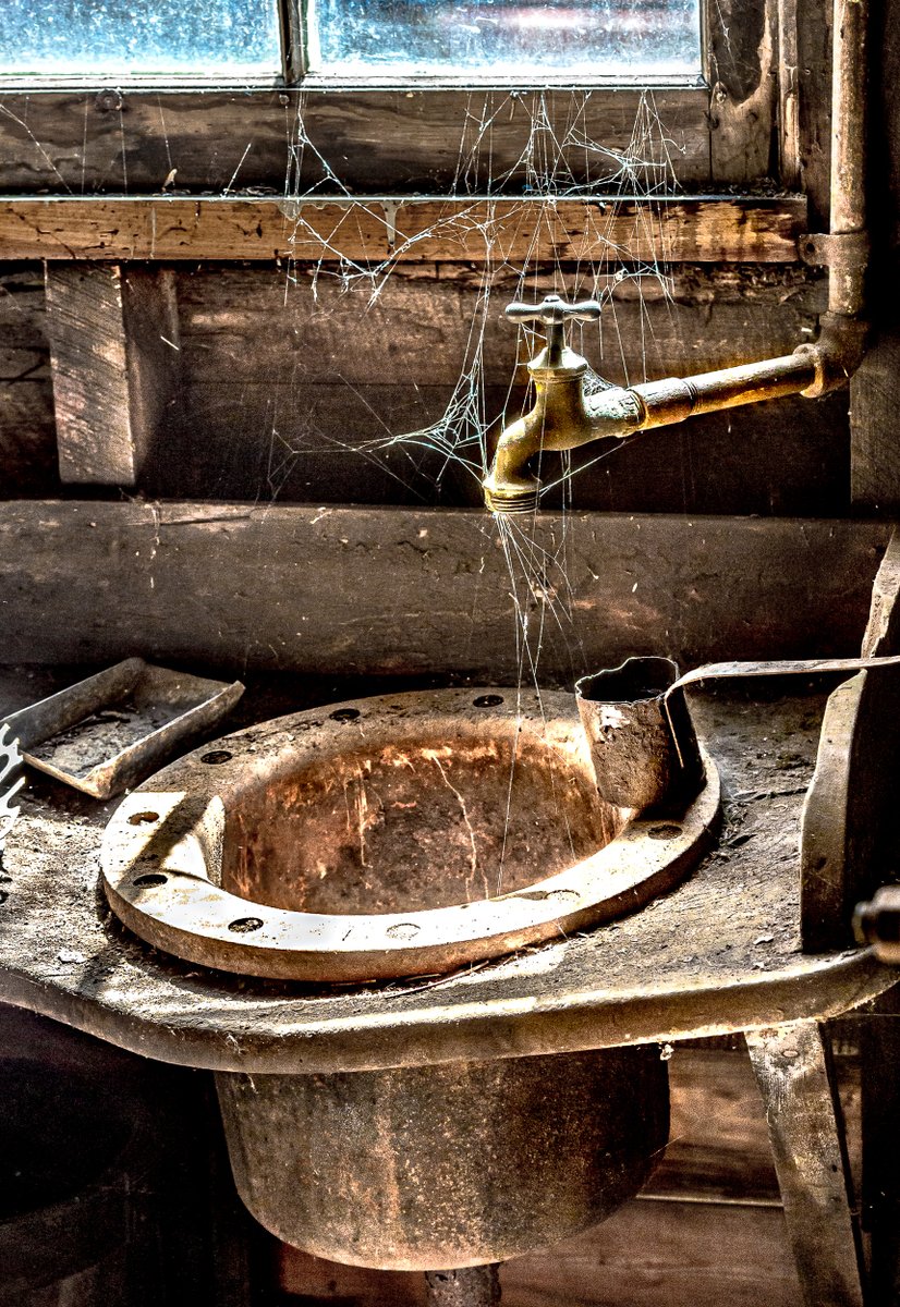 More great cobwebs in this foundry/machine shop that closed in 1965 - a sink in the foundry metal casting area. Because of its complete collection of machinery and tools, this shop earned the status of a National Historic Landmark in 2017. A foundation purchased it in 2009.