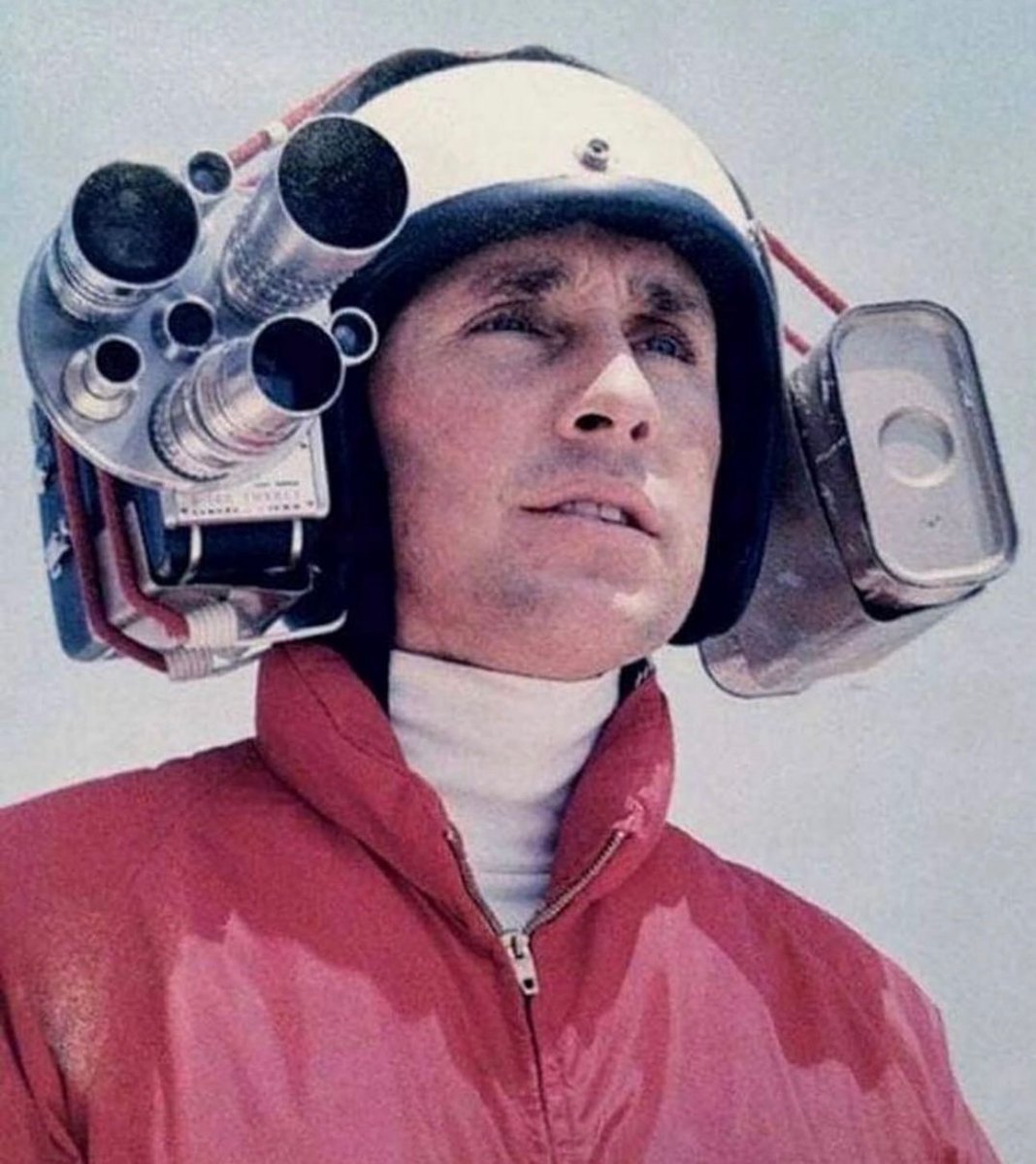 Formula One World Champion Jackie Stewart wearing an early helmet camera to capture onboard footage, 1966.