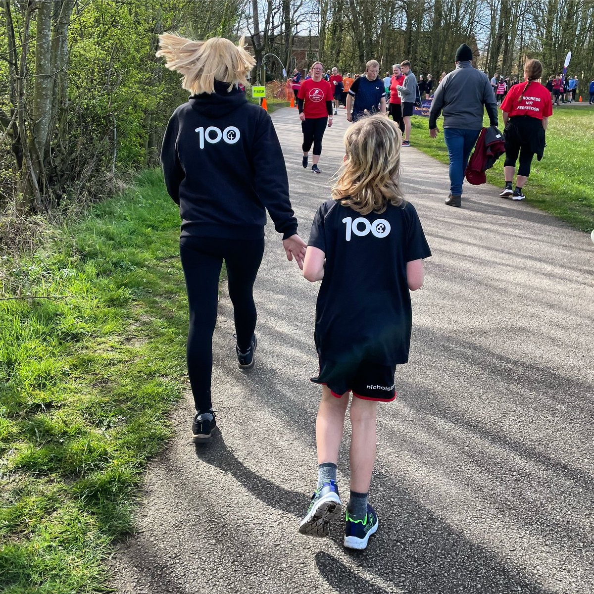 A new member of the 100 Club - so proud of my friend who has now reached this milestone, all whilst park-walking. My little buddy ran back to join his mum and celebrate her finish. parkrun is for everyone 🧡 #100club #loveparkrun