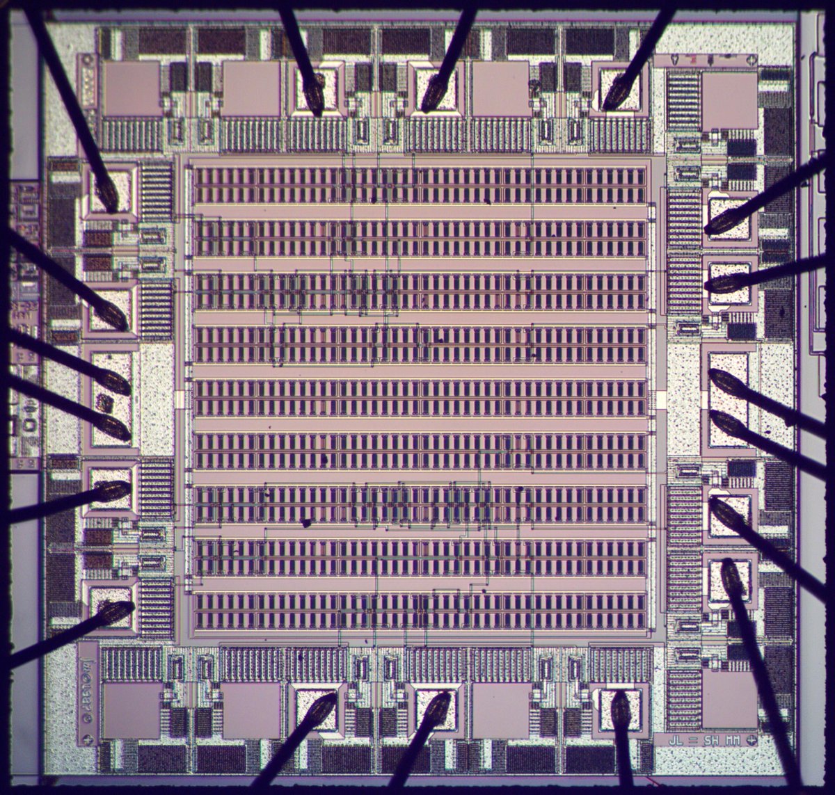 Here's an unusual chip, a 7400-series decoder implemented with a gate array. It has over 1500 transistors in orderly rows, but most of them are entirely unused. Why build a chip in such an inefficient way? Let's take a closer look... 1/13