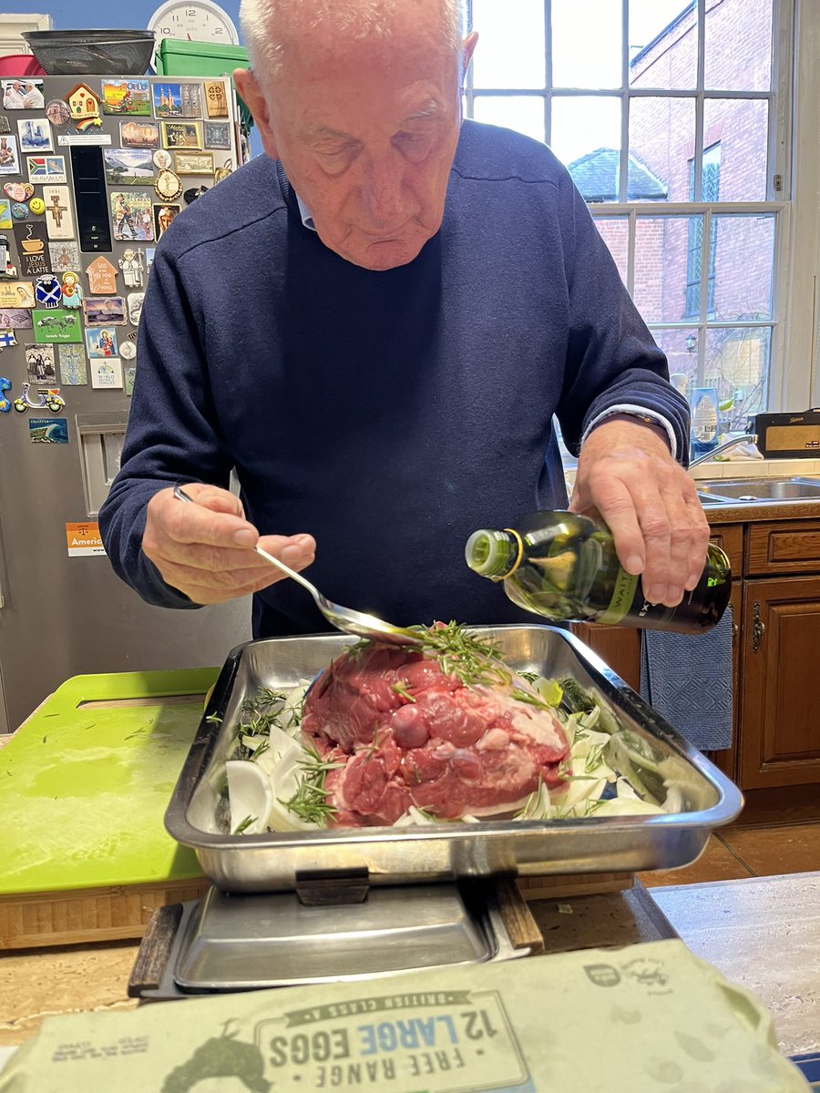 Monsignor preparing our paschal lamb for Easter lunch.